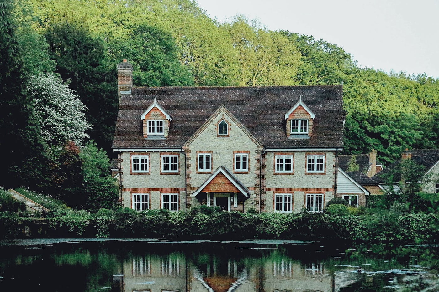 House exterior with rendering and roofing work in Twyford